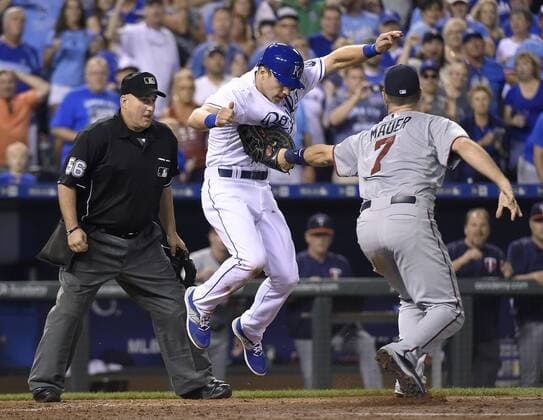 July 3, 2015 - Kansas City, MO, USA - Kansas City Royals pinch runner Dusty Coleman is tagged out by Minnesota Twins first baseman Joe Mauer (7) on a rundown at home on a fly ball out by Mike Moustakas to end the ninth inning on Friday, July 3, 2015, at Kauffman Stadium in Kansas City, Mo. Minnesota at Kansas City - ZUMAm67_