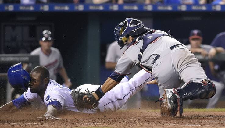 July 3, 2015 - Kansas City, MO, USA - Kansas City Royals Lorenzo Cain scores ahead of the tag from Minnesota Twins catcher Kurt Suzuki, right, in the 10th inning on Friday, July 3, 2015, at Kauffman Stadium in Kansas City, Mo. The Royals won, 3-2, in 10 innings. Minnesota at Kansas City - ZUMAm67_