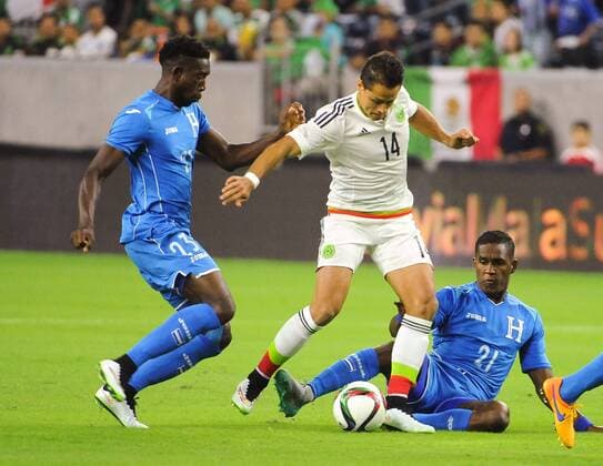 July 1st, 2015 - Mexico FW Javier Hernandez (14) attempts a shot past Honduras DF Johnny Palacios (23) and Honduras DF Brayan Beckeles (21) during the 2015 Mexican national team Nationalteam United States Tour, Mexico vs Honduras at NRG Stadium in Houston, Texas. SOCCER: JUL 01 Mexico v Honduras Icon15070108 EDITORIAL USE ONLY
