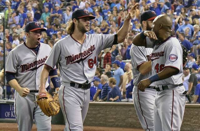 July 03, 2015: Minnesota Twins players celebrate after eliminating a Royals scoring threat in the bottom of the ninth inning during a Major League Baseball game between the Minnesota Twins and the Kansas City Royals at Kauffman Stadium in Kansas City. The Royals won in ten innings, 3-2. MLB Baseball Herren USA JUL 03 Twins at Royals Icon150703039 EDITORIAL USE ONLY