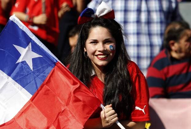 Football, Chile v Argentina Copa America 2015 . Chile s fan holds a flags prior to the finals of the Copa America 2015 football match played against Argentina at the Nacional stadium in Santiago, Chile. 04 07 2015 Martin Thomas Photosport Chile v Argentina o00 Nationalteam , Copa America 2015. 