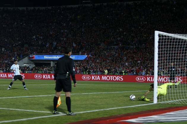 Football, Chile v Argentina. Copa America 2015 . Chile s goalkeeper Claudio Bravo, right, stops a penalty to Ever Banegas of Argentina during the finals of the Copa America 2015 football match held at the Nacional stadium in Santiago, Chile. 04 07 2015 Andres Pina Photosport Chile v Argentina, Copa America 2015. 