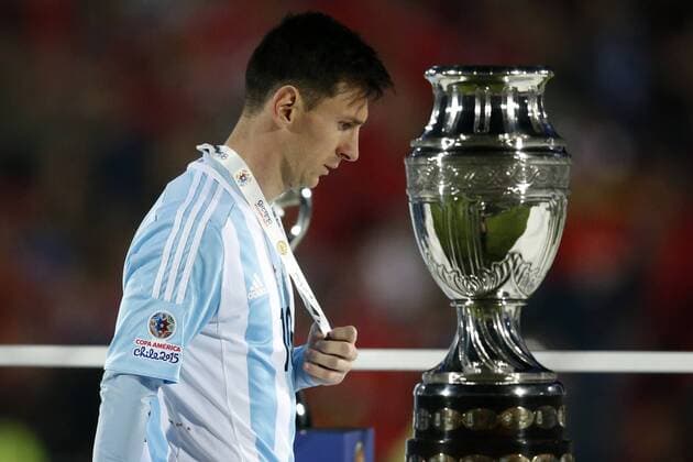 Football, Chile v Argentina. Copa America 2015 . Argentina s player, Lionel Messi, is pictured with the trophy after the finals of the Copa America 2015 football match played against Chile at the Nacional stadium in Santiago, Chile. 04 07 2015 Andres Pina Photosport Chile v Argentina, Copa America 2015. 