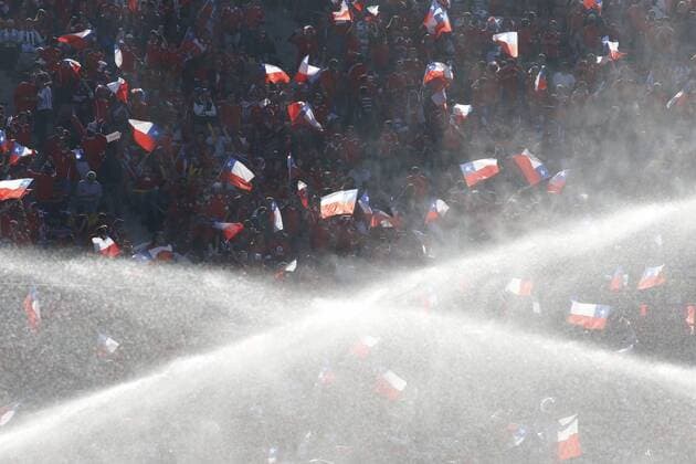 Football , Chile. Copa America 2015 . Chile s fans hold flags prior to the finals of the Copa America 2015 football match at the Nacional stadium in Santiago, Chile. 04 07 2015 Martin Thomas Photosport, Copa America 2015. 