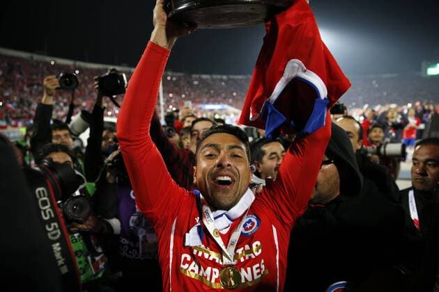 Football, Chile v Argentina. Copa America 2015 . Chile s player, Gonzalo Jara, lifts the cup after winning the Copa America 2015 in a football match against Argentina at the Nacional stadium in Santiago, Chile. 04 07 2015 Andres Pina Photosport Chile v Argentina, Copa America 2015. 