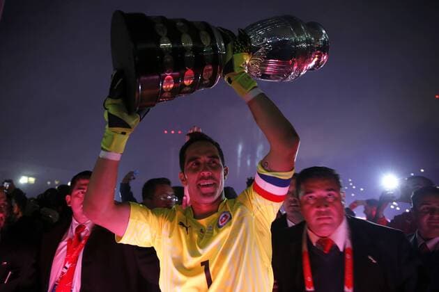 Football, Chile v Argentina. Copa America 2015 . Chile s goalkeeper, Claudio Bravo, lifts the cup after winning the Copa America 2015 in a football match against Argentina at the Nacional stadium in Santiago, Chile. 04 07 2015 Andres Pina Photosport Chile v Argentina, Copa America 2015. 