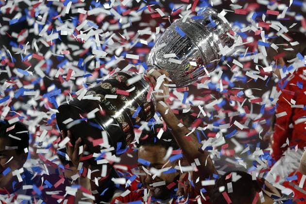 Football, Chile v Argentina. Copa America 2015 . Chile s player, Jean Beausejour, lifts the cup after winning the Copa America 2015 in a football match against Argentina at the Nacional stadium in Santiago, Chile. 04 07 2015 Andres Pina Photosport Chile v Argentina, Copa America 2015. 
