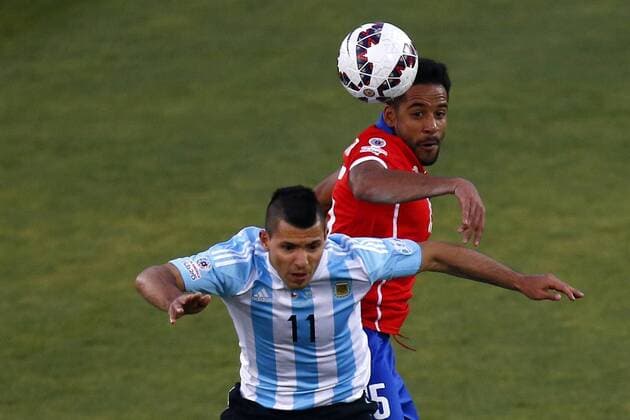 Football, Chile v Argentina. Copa America 2015 . Chile s player Jean Beausejour battles for the ball against Sergio Aguero of Argentina during the finals of the Copa America 2015 football match held at the Nacional stadium in Santiago, Chile. 04 07 2015 Christian Iglesias Photosport Chile v Argentina, Copa America 2015. 