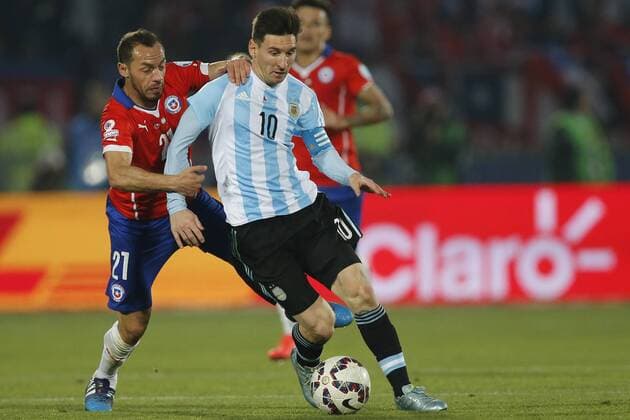Football, Chile v Argentina. Copa America 2015 . Argentina s player Lionel Messi, right , battles for the ball against Marcelo Diaz of Chile during the match of finals of the 2015 Copa America at Nacional stadium. Santiago, Chile. 04 07 2015 Marcelo Hernandez Photosport Chile v Argentina, Copa America 2015. 