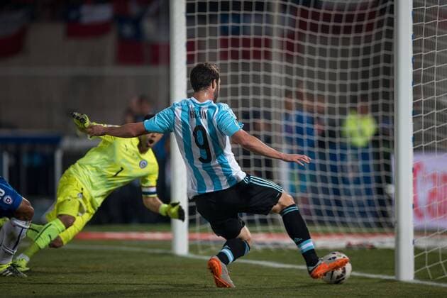 Football, Chile v Argentina. Copa America 2015 . Chile s goalkeeper Claudio Bravo , left, battles for the ball against Argentina s Gonzalo Higuain during to the finals of the Copa America 2015 football match played against Argentina at the Nacional stadium in Santiago, Chile. 04 07 2015 Fotoarena Photosport Chile v Argentina, Copa America 2015. 