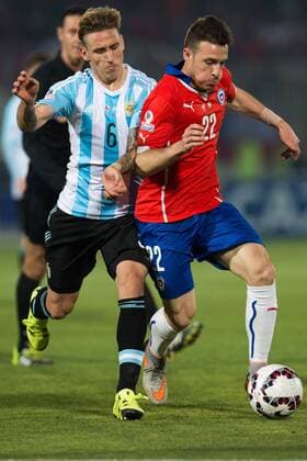 Football, Chile v Argentina. Copa America 2015 . Chile s player Alexis Sanchez , right, battles for the ball against Argentina s Lionel Messi during to the finals of the Copa America 2015 football match played against Argentina at the Nacional stadium in Santiago, Chile. 04 07 2015 Fotoarena Photosport Chile v Argentina, Copa America 2015. 