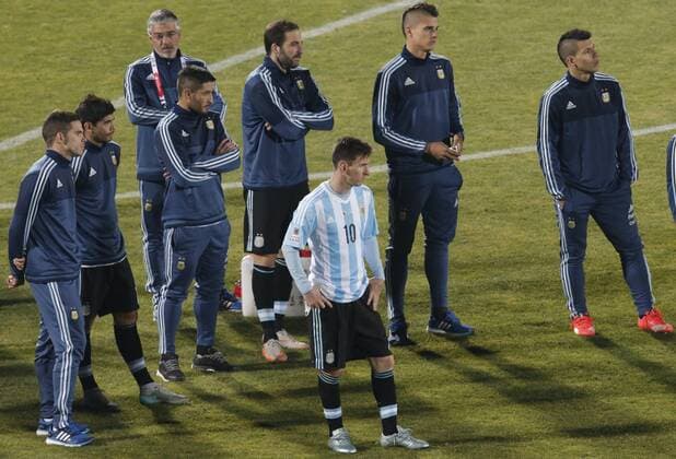 (150705) -- SANTIAGO, July 4, 2015 -- Lionel Messi (C) of Argentina reacts after the final match of the Copa America Chile 2015 against Chile, at the National Stadium, in Santiago, capital of Chile, on July 4, 2015. Chile won the final match of the Copa America 2015 against Argentina after the penalty kick 4-1. Guillermo Arias) (ce) (SP)CHILE-SANTIAGO-COPA AMERICA-FINAL-CHILE VS ARGENTINA JorgeVillegas 