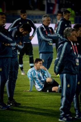 (150705) -- SANTIAGO, July 4, 2015 -- Lionel Messi (C) of Argentina reacts after the final match of the Copa America Chile 2015 against Chile, at the National Stadium, in Santiago, capital of Chile, on July 4, 2015. Chile won the final match of the Copa America 2015 against Argentina after the penalty kick 4-1. Guillermo Arias) (ce) (SP)CHILE-SANTIAGO-COPA AMERICA-CHILE VS ARGENTINA PedroxMera 