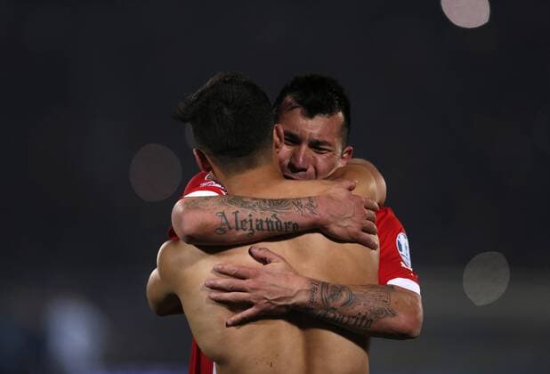 (150705) -- SANTIAGO, July 4, 2015 -- Alexis Sanchez (Front) of Chile celebrates with a teammate after the final match of the Copa America Chile 2015 against Argentina, at the National Stadium, in Santiago, capital of Chile, on July 4, 2015. Chile won the final match of the Copa America 2015 against Argentina after the penalty kick 4-1. ) (ce) (SP)CHILE-SANTIAGO-COPA AMERICA-FINAL-CHILE VS ARGENTINA GuillermoxArias 