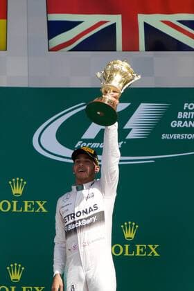 05.07.2015. Silverstone, Northants, England. Formula 1 British Grand Prix. Lewis Hamilton, Mercedes AMG Petronas F1 Team holds the winners trophy on the podium after his 3rd British GP win. xTimxWilliamsx  ActionPlus11638031