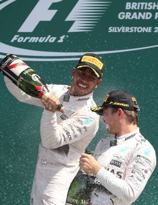 (150705) -- SILVERSTONE, JULY 5, 2015 -- Britian s Lewis Hamilton (L) of Mercedes Team celebrates with his teammate Nico Rosberg after 2015 Formula 1 British Grand Prix at Silverstone Circuit, Great Britain, on July 5, 2015. ) (SP)BRITAIN-SILVERSTONE CIRCUIT-FORMULA 1-BRITISH GRAND PRIX HanxYan 