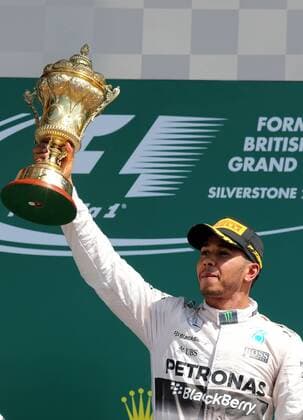 (150705) -- SILVERSTONE, JULY 5, 2015 -- Britian s Lewis Hamilton of Mercedes Team celebrates with the trophy after 2015 Formula 1 British Grand Prix at Silverstone Circuit, Great Britain on July 5, 2015. ) (SP)BRITAIN-SILVERSTONE CIRCUIT-FORMULA 1-BRITISH GRAND PRIX HanxYan 