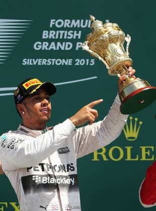 (150705) -- SILVERSTONE, JULY 5, 2015 -- Britian s Lewis Hamilton of Mercedes Team celebrates with the trophy after 2015 Formula 1 British Grand Prix at Silverstone Circuit, Great Britain on July 5, 2015. ) (SP)BRITAIN-SILVERSTONE CIRCUIT-FORMULA 1-BRITISH GRAND PRIX HanxYan 