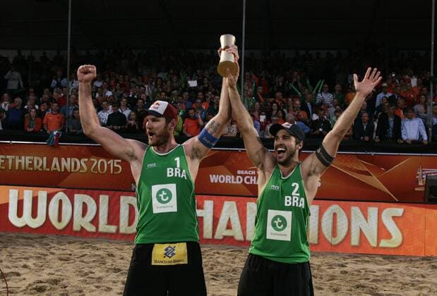 Alison Cerutti (L) from Brazil celebrates with his teammate Bruno Oscar Schmidt (R) during the FIVB Beach volleyball Beachvolleyball World Championships Male Final Match between Brazil vs Netherlands on July 5, 2015 in The Hague, Netherlands. Imago Paulo Amorim