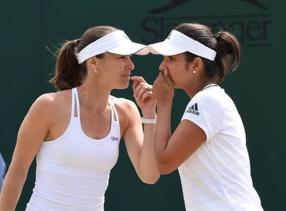 Tennis - 2015 Wimbledon Championships - Week Two, DAY 7 Monday Women s Doubles, fourth Round Martina Hingis and Sania Mirza vs. Anabel Medina Garrigues and Arantxa Parra Santonja Martina Hingis talks to Sania Mirza on Court 6 COLORSPORT ANDREW COWIE 