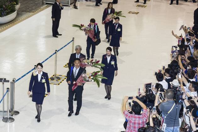 Coach Norio Sasaki arrives at Narita International Airport with other members of the Japan women s national football team on July 7, 2015, Narita, Japan. Large crowds gathered in the arrival area to greet the returning idols who had been playing in the FIFA Women s World Cup 2015 in Canada. Japan lost in the final against USA and many supporters turned up to welcome them home. Noxthirdxpartyxsales  (gxta006292)