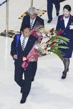 Coach Norio Sasaki arrives at Narita International Airport with other members of the Japan women s national football team on July 7, 2015, Narita, Japan. Large crowds gathered in the arrival area to greet the returning idols who had been playing in the FIFA Women s World Cup 2015 in Canada. Japan lost in the final against USA and many supporters turned up to welcome them home. Noxthirdxpartyxsales  (gxta006293)