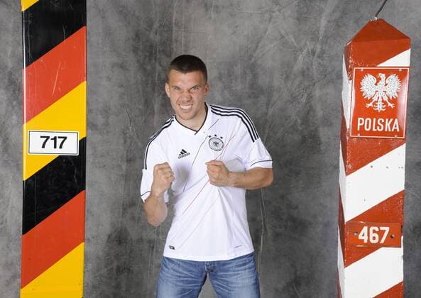 Lukas Podolski EM Serie mit deutschen und polnischem Grenzstein am 19.4.2012 in Köln Lukas Podolski