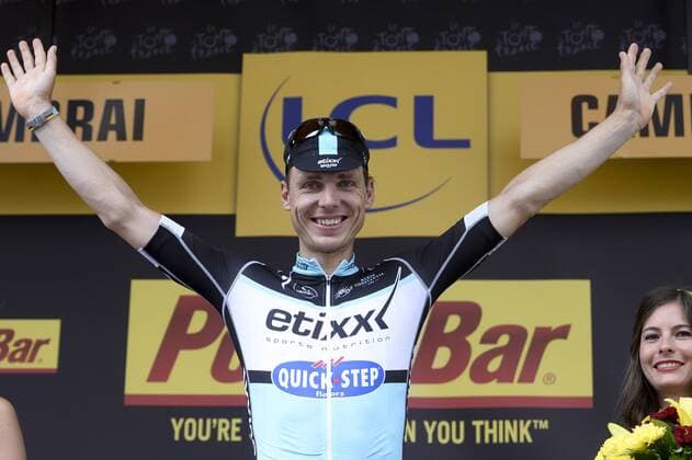 - CAMBRAI, FRANCE: German Tony Martin of team Ettix - Quick-Step celebrates on the podium after stage 4 of the 102nd edition of the Tour de France cycling race, 223,5km from Seraing, Belgium, to Cambrai, France, Tuesday 07 July 2015. This year s Tour de France is taking place from 4 to 26 July. DIRKxWAEM  x04660109x