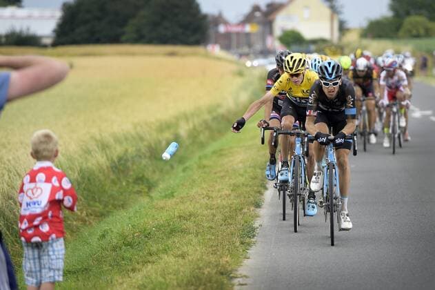 - CAMBRAI, FRANCE: British Chris Froome of Team Sky, wearing the yellow jersey of leader in the overall ranking, gives his drinking bottle to a kid during stage 4 of the 102nd edition of the Tour de France cycling race, 223,5km from Seraing, Belgium, to Cambrai, France, Tuesday 07 July 2015. This year s Tour de France is taking place from 4 to 26 July. YORICKxJANSENS  x04660165x