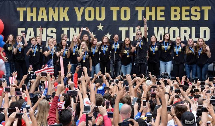 The United States of America women s soccer team lead by Abby Wambach (pointing skyward) celebrate their 2015 Women s World Cup victory during a rally at Microsoft Square in Los Angeles on July 7, 2015.  LAP2015060706 JIMxRUYMEN