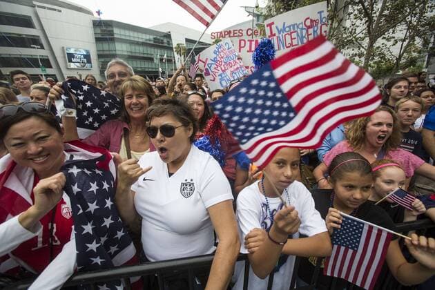 July 7, 2015 - Los Angeles, California, U.S - Fans of U.S. women s soccer team cheer during a rally to celebrate victory of the 2015 Women s World Cup during a rally at LA Live on July 7, 2015 in Los Angeles, California. The team defeated Japan 5-2 during Sunday s FIFA Women s World Cup in Canada. U.S. women s soccer team celebrates its World Cup victory - ZUMAc68_