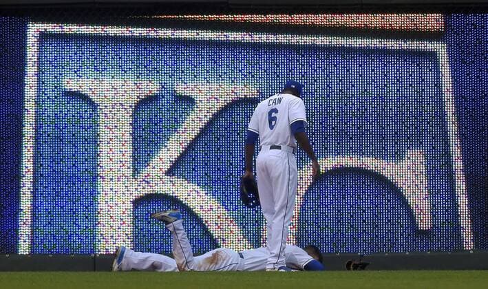 July 8, 2015 - Kansas City, MO, USA - Kansas City Royals center fielder Lorenzo Cain (6) checks on left fielder Alex Gordon, who is on the ground with an injury after hitting the wall chasing an inside the park home run by the Tampa Bay Rays Logan Forsythe in the fourth inning on Wednesday, July 8, 2015, at Kauffman Stadium in Kansas City, Mo. Tampa Bay at Kansas City - ZUMAm67_