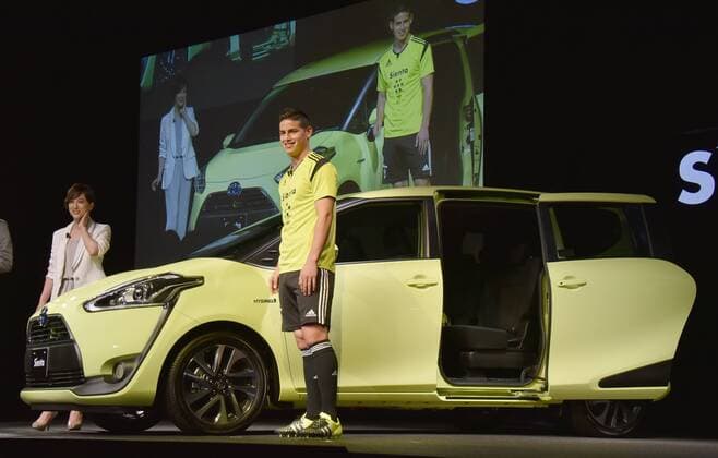 July 9, 2015, Tokyo, Japan - Colombian soccer super star James Rodriguez is on hand to give a big support to Toyota Motor Corp. as the Japanese automaker introduces its new Sienta, a small five-door minivan, during a launch at Toyota s head office in Tokyo on Thursday, July 9, 2015. Rodriguez, now playing at Spain s Real Madrid, was in town for his first TV commercial appearance in Japan. With Rodriguez is Japanese celebrity Christel Takigawa. NoxThirdxPartyxSales  (65146762)