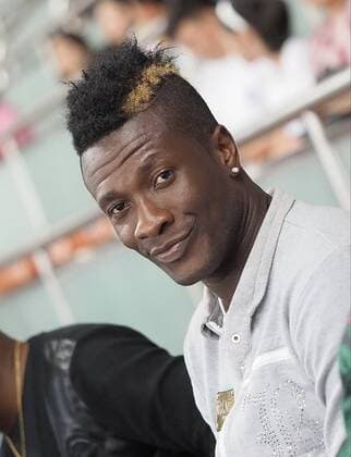 SHANGHAI, CHINA - JULY 08: (CHINA OUT) Ghana s striker Asamoah Gyan watches from the stand during the 2015 CFA Cup between Shanghai SIPG FC and Guangzhou R&F FC at Shanghai Stadium on July 8, 2015 in Shanghai, China. Asamoah Gyan will sign a contract with Chinese Super League s Shanghai SIPG Football Club.  CFP65149012 