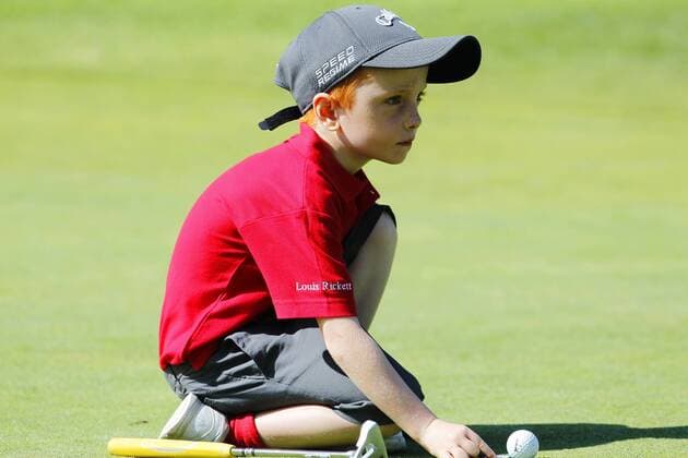 July 14, 2015 - San Diego, California, United States - July 14, 2015_San Diego, CA_USA_ Louis Rickett lines up a putt during the Junior World Golf Championships 6 and under division at Colina Park Golf Course. Photo by Louis Rickett lines up a putt during the Junior World Golf Championships 6 and under division at Colina Park Golf Course. - ZUMAs44_
