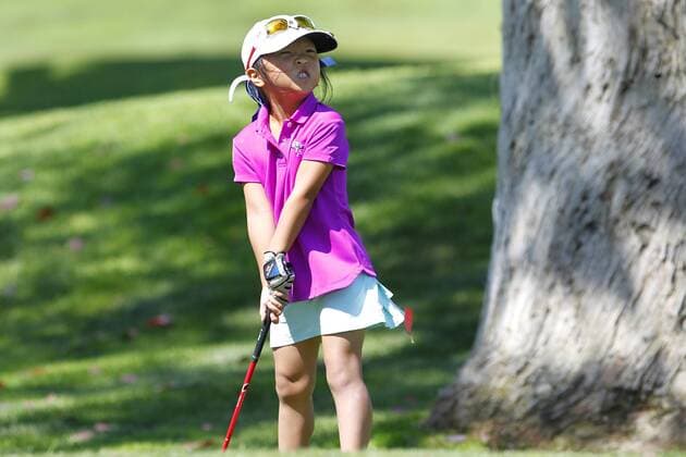 July 14, 2015 - San Diego, California, United States - July 14, 2015_San Diego, CA_USA_ Anna Fang of Escondido, lines up a shot during the Junior World Golf Championships 6 and under division at Colina Park Golf Course. Photo by Anna Fang of Escondido, lines up a shot during the Junior World Golf Championships 6 and under division at Colina Park Golf Course. - ZUMAs44_