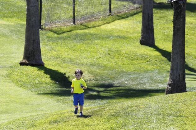 July 14, 2015 - San Diego, California, United States - July 14, 2015_San Diego, CA_USA_ James Grimes III, 4, runs to his ball after a shot during the first round of the Junior World Golf Championships 6 and under division at Colina Park Golf Course. Photo by James Grimes III, 4, runs to his ball after a shot during the first round of the Junior World Golf Championships 6 and under division at Colina Park Golf Course. - ZUMAs44_