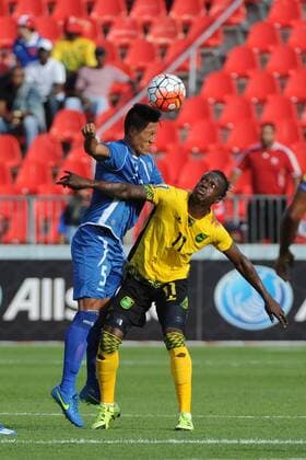 July 14, 2015: El Salvador D Alexander Mendoza (5) and Jamaica F Darren Mattocks (11) in action during the CONCACAF Gold Cup game between Jamaica and El Salvador at BMO Field in Toronto, Ont. SOCCER: JUL 14 CONCACAF Gold Cup - Group Stage - Jamaica v El Salvador Icon15071410 EDITORIAL USE ONLY