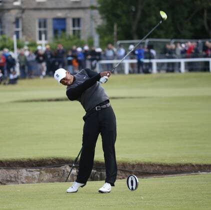 American Tiger Woods plays a fairway iron in the Champion s Challenge ahead of the start of the144th Open Championship, St.Andrews on July 15, 2015.  LON2015071504 HUGOxPHILPOTT