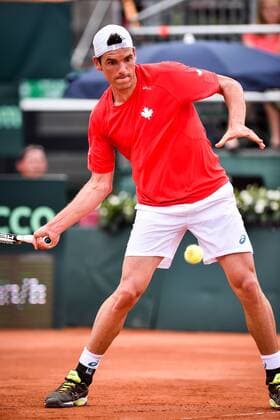 - MIDDELKERKE, BELGIUM: Canada s Frank Dancevic pictured in action during the first game between Belgian Steve Darcis and Canadian Frank Dancevic at the Davis Cup quarter final World Group meeting between Belgium and Canada, Friday 17 July 2015 in Middelkerke. LUCxCLAESSEN  x04666261x