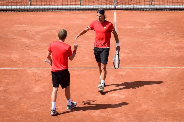 - MIDDELKERKE, BELGIUM: Belgian Kimmer Coppejans and Belgian Ruben Bemelmans celebrate during the third game, a double match between Belgians Ruben Bemelmans and Kimmer Coppejans and Canadians Daniel Nestor and Adil Shamasdin at the Davis Cup quarter final World Group meeting between Belgium and Canada, Saturday 18 July 2015 in Middelkerke. LUCxCLAESSEN  x04666854x