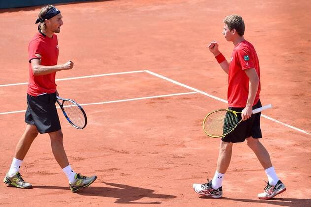 - MIDDELKERKE, BELGIUM: Belgian Ruben Bemelmans and Belgian Kimmer Coppejans celebrate during the third game, a double match between Belgians Ruben Bemelmans and Kimmer Coppejans and Canadians Daniel Nestor and Adil Shamasdin at the Davis Cup quarter final World Group meeting between Belgium and Canada, Saturday 18 July 2015 in Middelkerke. LUCxCLAESSEN  x04666868x