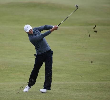 American Jordan Spieth plays a fairway shot on the fourth hole during the third round at the 144th Open Championship, St.Andrews on July 19 2015.  LON2015071905 HUGOxPHILPOTT
