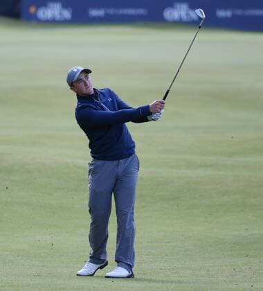 Irish amateur Paul Dunne chips onto the eighteenth green during the third round at the 144th Open Championship, St.Andrews on July 19 2015.  LON2015071948 HUGOxPHILPOTT