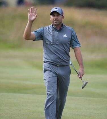 Spain s Sergio Garcia waves to the spectators on the 17th green during the third round at the 144th Open Championship, St.Andrews on July 19 2015.  LON2015071929 HUGOxPHILPOTT