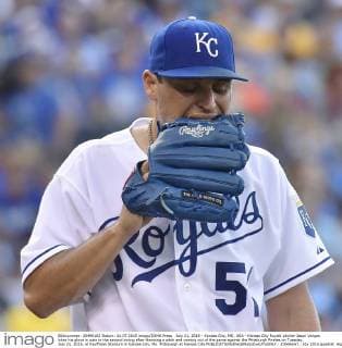 July 21, 2015 - Kansas City, MO, USA - Kansas City Royals pitcher Jason Vargas bites his glove in pain in the second inning after throwing a pitch and coming out of the game against the Pittsburgh Pirates on Tuesday, July 21, 2015, at Kauffman Stadium in Kansas City, Mo. Pittsburgh at Kansas City - ZUMAm67_
