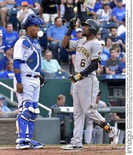 July 21, 2015 - Kansas City, MO, USA - The Pittsburgh Pirates Starling Marte (6) thought he was celebrating a home run in front of Kansas City Royals catcher Salvador Perez before a review of the play sent him back to second in the second inning on Tuesday, July 21, 2015, at Kauffman Stadium in Kansas City, Mo. Pittsburgh at Kansas City - ZUMAm67_