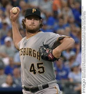 July 21, 2015 - Kansas City, MO, USA - Pittsburgh Pirates starting pitcher Gerrit Cole throws out the Kansas City Royals Lorenzo Cain at first on a grounder in the fourth inning on Tuesday, July 21, 2015, at Kauffman Stadium in Kansas City, Mo. Pittsburgh at Kansas City - ZUMAm67_