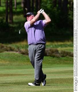 25.07.2015. Sunningdale, England. Seniors Open Golf during the rain delayed Tournament Round 2. Ronan Rafferty (NIR) with his approach shot in to the green xJonxBromleyx  ActionPlus11643239