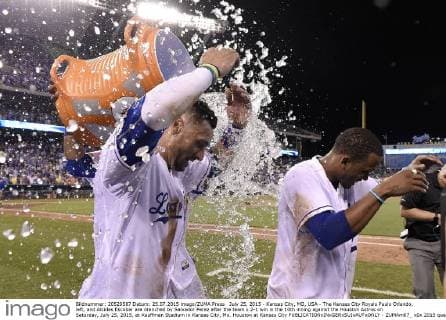 July 25, 2015 - Kansas City, MO, USA - The Kansas City Royals Paulo Orlando, left, and Alcides Escobar are drenched by Salvador Perez after the team s 2-1 win in the 10th inning against the Houston Astros on Saturday, July 25, 2015, at Kauffman Stadium in Kansas City, Mo. Houston at Kansas City - ZUMAm67_